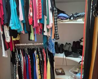 Multiple closets with tons of designer clothes, shoes, etc.