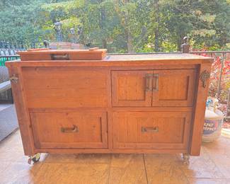 Handcrafted Solid Wood Outdoor Bar with marble top cutting board, built in cooler and water spicut. By Rustic Woodworx of North Atlanta