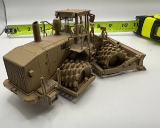 Norscot 1:50 scale diecast model of a Caterpillar 815F Military Soil Compactor