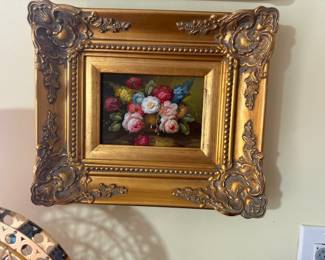 Floral painting with ornate gold leaf frame