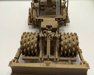 1:50 scale diecast model of a Caterpillar 815F Military Soil Compactor, specifically the Norscot model 55254