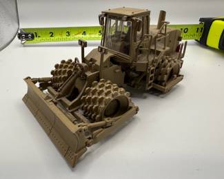 1:50 scale diecast model of a Caterpillar 815F Military Soil Compactor, specifically the Norscot model 55254