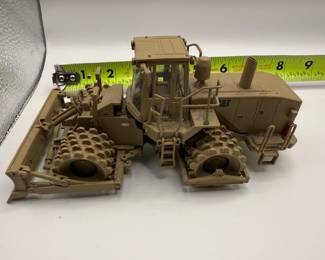1:50 scale diecast model of a Caterpillar 815F Military Soil Compactor, specifically the Norscot model 55254