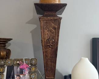 vintage-style tall candlestick holder- with a fleur-de-lis embellishment