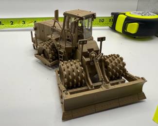 Norscot 1:50 scale diecast model of a Caterpillar 815F Military Soil Compactor
