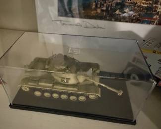scale model of an M48A3 Patton tank displayed within a clear protective case