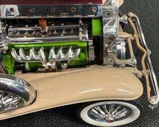 1930 Duesenberg “J” Derham Tourster from the Franklin mint 1/18 scale diecast model. original tag and removable hardtop.