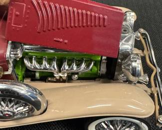 1930 Duesenberg “J” Derham Tourster from the Franklin mint 1/18 scale diecast model. original tag and removable hardtop.