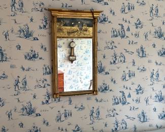 Federal Gold leaf looking glass mirror
Upper eglomise panel depicting a maritime scene with burning ship,
Some rubbed gilt
31 ¼” x 20”, American, circa 1820