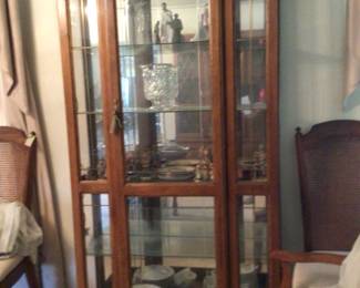 Pulaski curio cabinet $450.; Lladro; Hummel’s; crystal