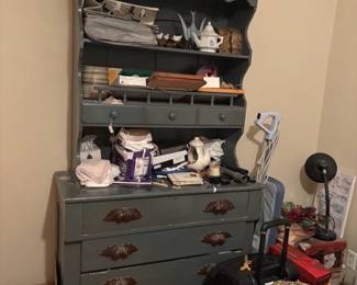 Antique cupboard with tea pots
Books
Pictures
Crocks