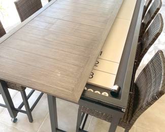 Home Decorators Collection outdoor convertible shuffleboard table with eight (8) chairs. The table can be closed for dining or open for play. Measures 9’9” long and 26” high. Open the table measures 56” wide and closed it measures 35” wide. It’s a super cool party piece for the outdoor living area.