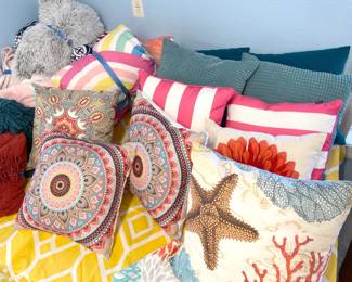 So many throw pillows and throw blankets.