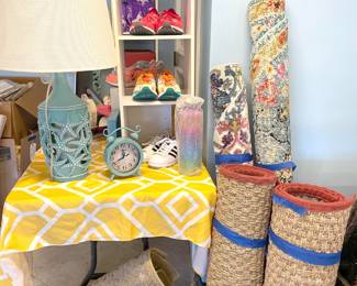 Little rugs and a peek at these two turquoise starfish lamps that throw light from below (in the cutout) or above or both.
