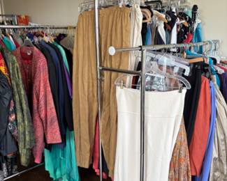 Lots and lots of women’s clothes, larger sizes, mostly 16-20 with some 12-14, some vintage clothing, lots of clothes from Asia, South America, Mexico, Africa and the Middle East, many bought on their myriad of travels, many are new with tags (never worn, at one point they were thinking of opening a store with imported ethnic and tribal clothing and purchased a lot of stock but never opened the store). There are 5 packed rails plus a huge walk in closet full of clothes.