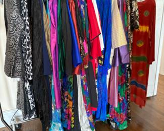 Lots and lots of women’s clothes, larger sizes, mostly 16-20 with some 12-14, some vintage clothing, lots of clothes from Asia, South America, Mexico, Africa and the Middle East, many bought on their myriad of travels, many are new with tags (never worn, at one point they were thinking of opening a store with imported ethnic and tribal clothing and purchased a lot of stock but never opened the store). There are 5 packed rails plus a huge walk in closet full of clothes.