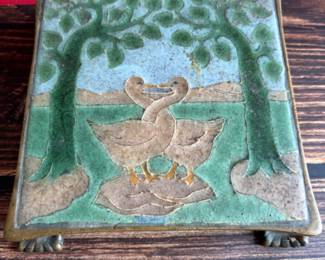 Circa 1917 molded Grueby Pottery Tile set in a bronze trivet by Tiffany Glass Company (Louis Comfort Tiffany)