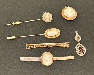 Gold lapel pins, brooches, and pendants