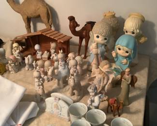 Precious Moments five piece natavity…large.  Also a smaller version with Crèche..  extra large camel and smaller camels.  Precious Moments cups and napkin holder