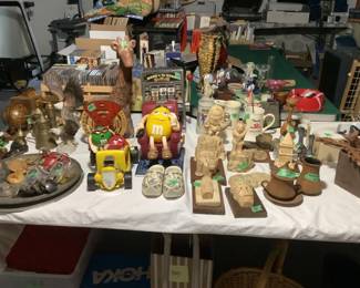 Interesting collectibles such as M &M container, slot machine, year long calendar, older bookends, sandcastings, Dutch shoes