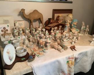 Large assortment of Precious Moments.  Single and double statues, plates and cups, Bible, nativity sets, tablecloth, 