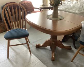 Oak pedestal table with two chairs.  42” sq. Presale $100