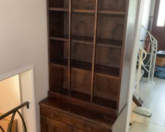 Wooden hutch…..decorative shelving and lower cabinet.  Measures 27” w x  77” h x 18” d….two pieces.  Presale $75.