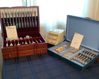 Two more sets of flatware with storage boxes