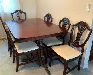 Cherry dining room table with 3 leaves, six chairs and pads.  Measures 60” l x 42” wide.  Leaves measure 12” table would extend to 96”.  Presale $350