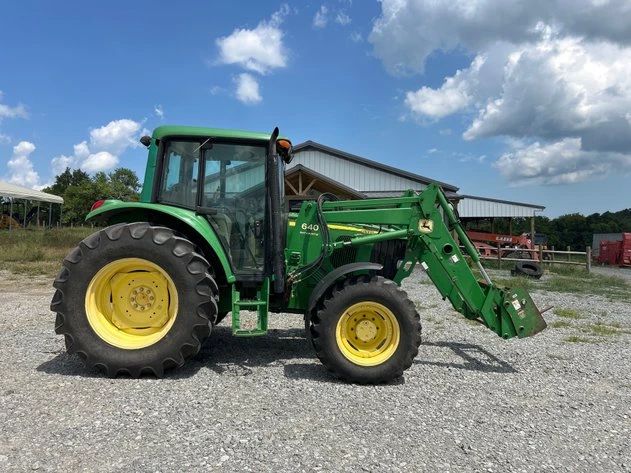 JOHN DEERE 6320 4X4 CAB TRACTOR AND LOADER