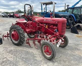 A FARMALL OFFSET TRACTOR WITH CULTIVATORS