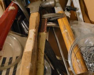 Large assortment of hammers, screwdrivers and other tools