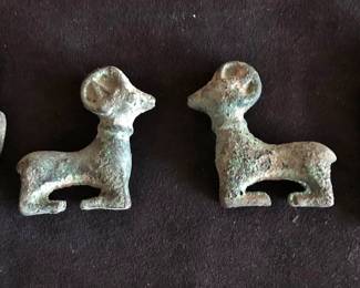 Middle:  Luristan Bronze Rams, ca. 1000-650 BC, if genuine.  Sides:  Bronze Effigies,  possibly Ushbati, but don't look very Egyptian to me ... researching!
