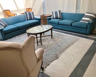 Pair Sofas; Persian-Style Rug, Velvet Wingback Armchair; Glass-Top Oval Coffee Table