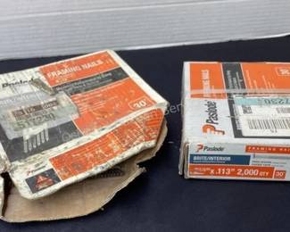Several boxes of Paslode nails of different sizes
