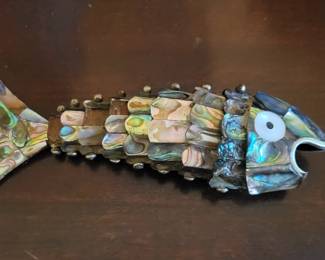 Sterling silver and abalone fish.