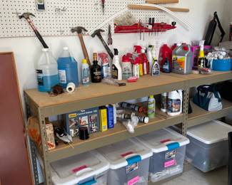 Tools, cleaning supplies and boxes of plumbing, painting supplies.