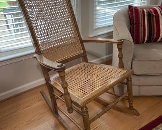 Classic Cane-Seat Rocking Chair - Timeless Comfort! Beautiful traditional rocker featuring woven cane seat and back, wood frame with turned details. Perfect for nursery, porch, or reading nook. $50