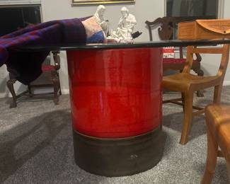 Four hands home glass top dining table. 