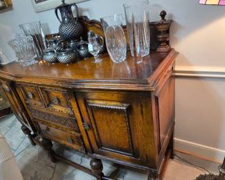 Antique buffet/sideboard with beautifully carved details.