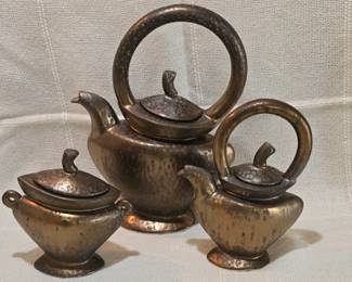 vintage art pottery tea set created by Michael Lambert, a renowned ceramist known for his whimsical and sculptural pieces.