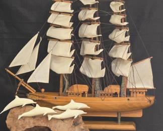 Collectible Tall Ship with cloth sails and a John Perry dolphin sculpture