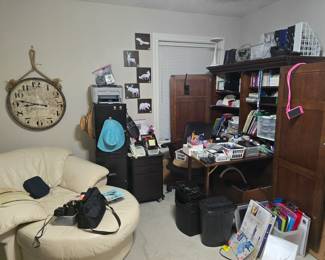 Office is packed with useful supplies, hide-away desk folds up and closes behind the doors to look like an armoire, printers, phones, file cabinets, and so much more!