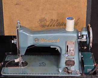 Vintage Monarch Syncro-Matic sewing machine made in Japan with attachments
