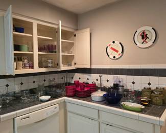Kitchen is full of dish sets, dishware, bakeware, small appliances and more