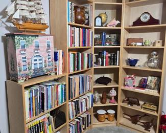 Bookshelves are for sale! Lots of books and interesting decor