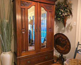 Antique armoire with mirror and drawer