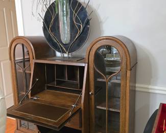 Antique drop-front desk with a leather writing mat, and display cabinets on both sides