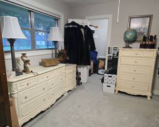 Ivory colored suite includes a double dresser, chest of drawers, and a nightstand