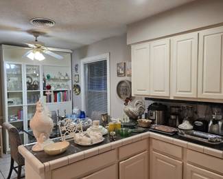 Kitchen is full of dish sets, dishware, bakeware, small appliances and more